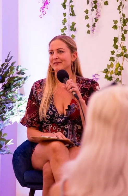 Maria speaking at an event