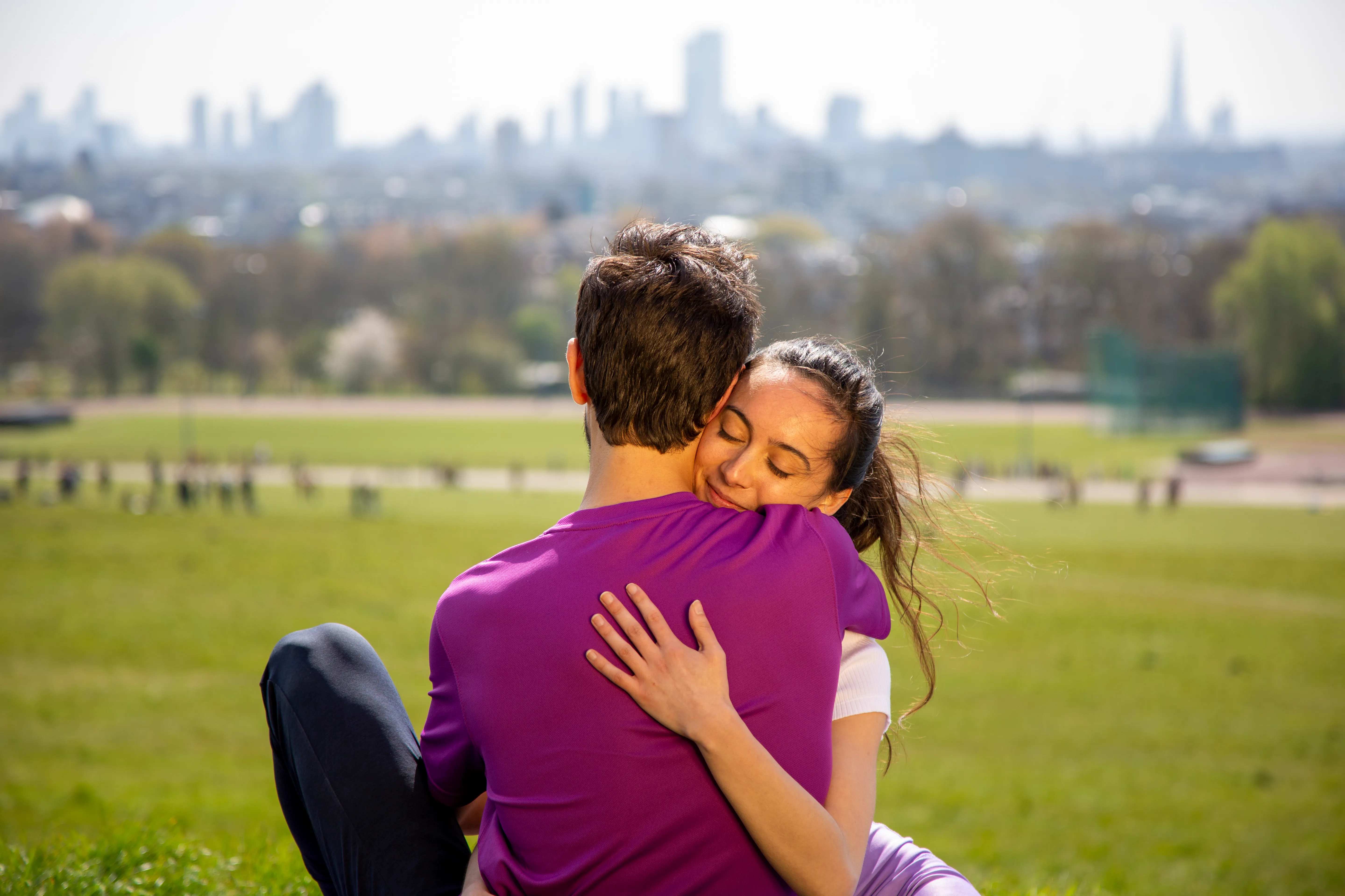 Couple in tender embrace with eyes closed